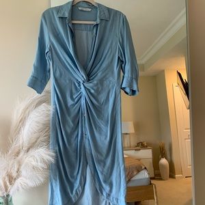 Fitted blue dress with wrap detail